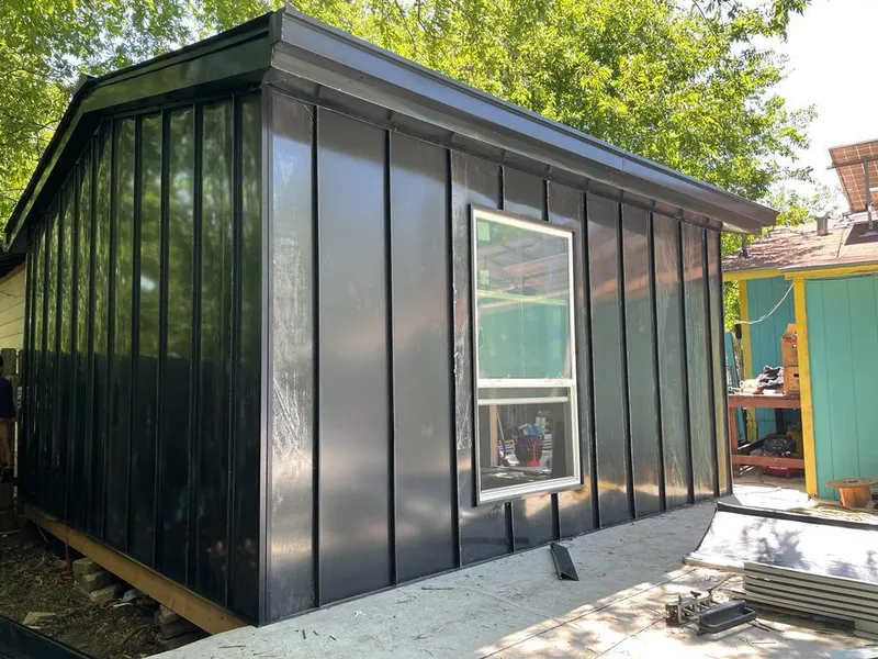 Black standing seam metal wall panels for Roof Inspection in Commerce